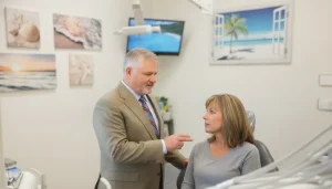 Dentist discussing tooth replacement options with a patient in a Cameron Park dental office